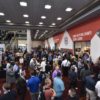 A vibrant, bustling trade show floor at PACK EXPO Las Vegas 2023.